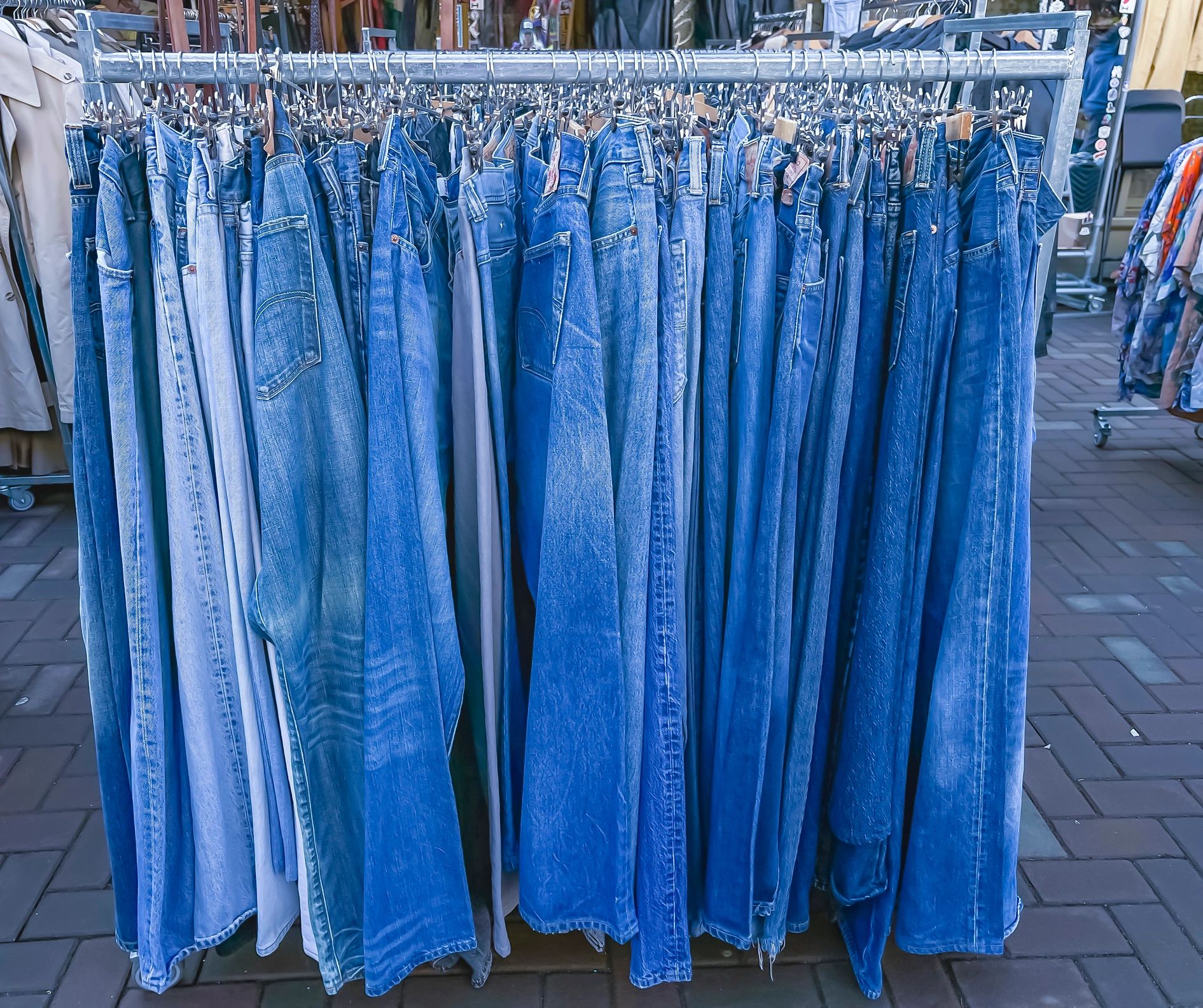 Clothes rack with neatly hung denim jeans
